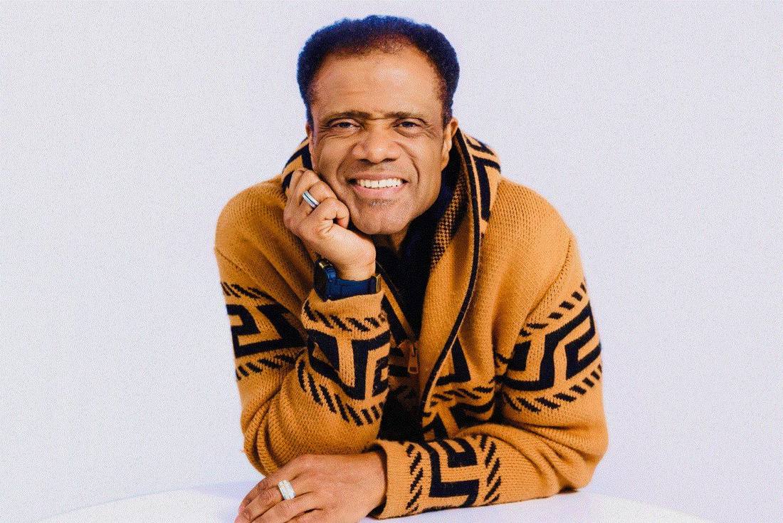 Dr. Kahan Sablo smiling in a warm patterned cardigan