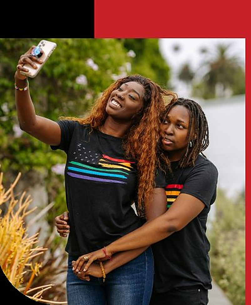 Two friends celebrating together, representing the LGBTQ+ affirming community Elevation C³ serves